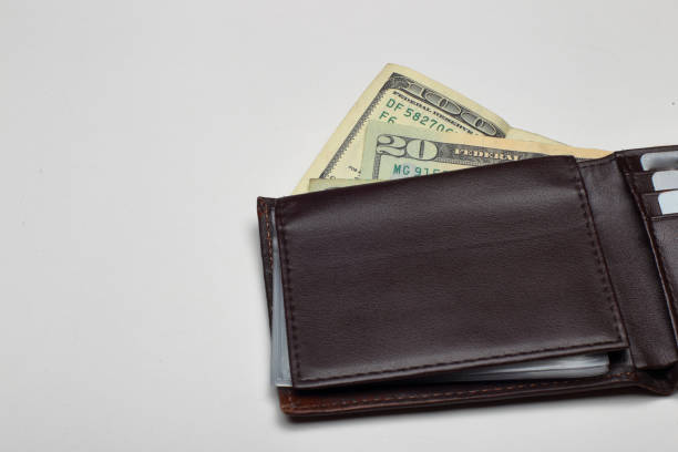 istock Money in mens wallet 937018766