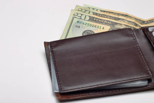 istock Money in mens wallet 937018822