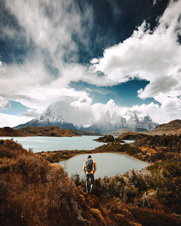 man hiking at torres del paine - chile