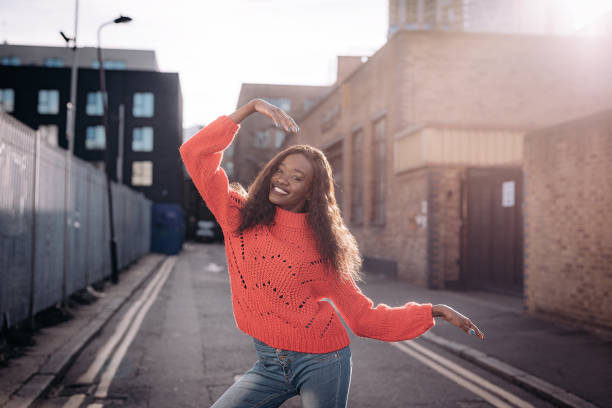 istock Ecstatic Cameroon woman smiling and raising her arms 937034696