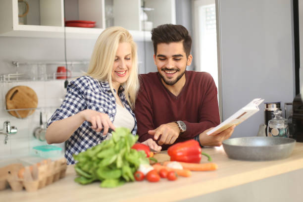 istock Young couple cooking together 937035008