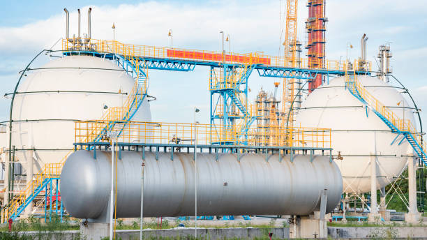 istock Refinery storage tanks under the blue sky white clouds 937035070