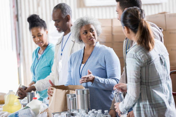 istock Group of people organize donations during food drive 937035316