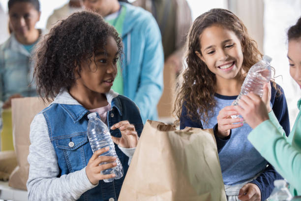istock Young girls volunteering in their community 937035330