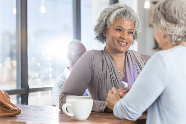 istock Attentive woman has discussion with friend 937037486