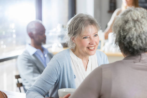 istock Senior women enjoy cup of coffee 937037500