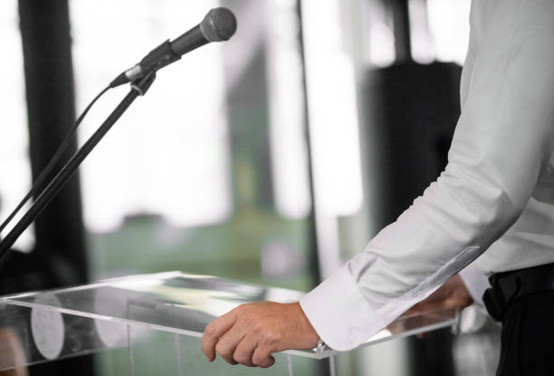 istock Unrecognizable person giving speech at awards ceremony 937037590