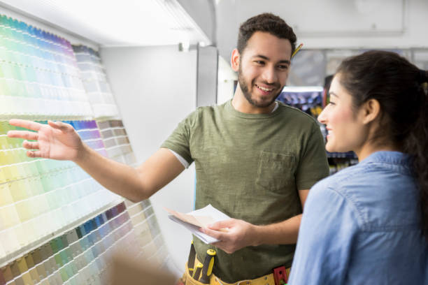 istock Confident home improvement store salesperson helps customer 937037712