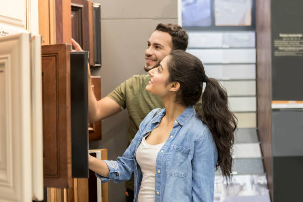 istock Young couple shopping in home improvement store 937037714