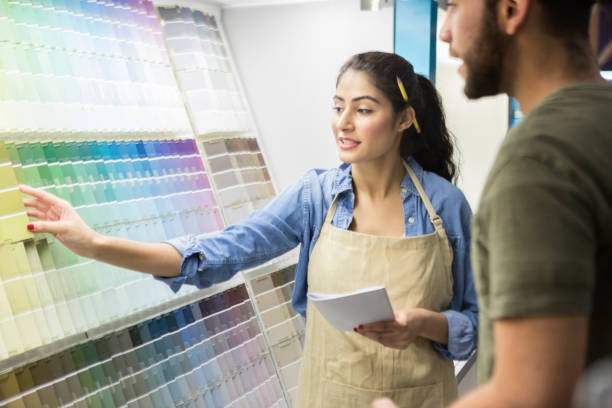 istock Confident hardware store salesperson assisting customer 937037720