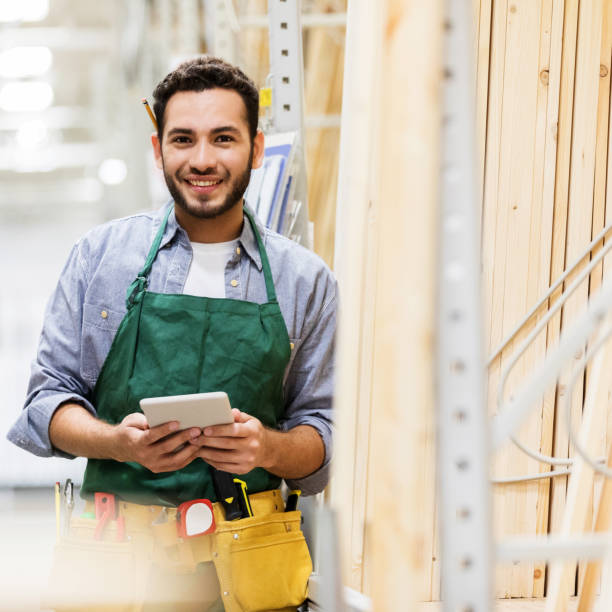 istock Handsome young man working in home improvement store 937037772