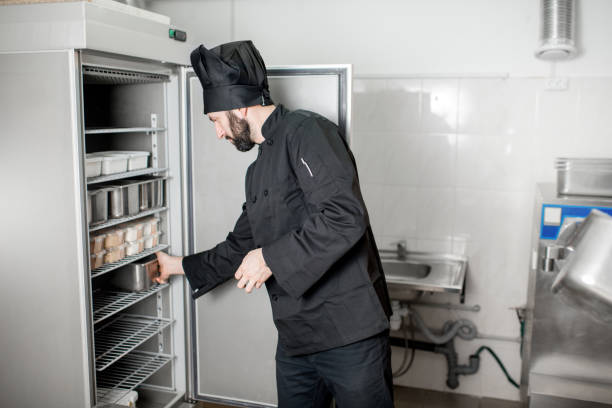 istock Chef cook getting food from the refrigerator 937039054