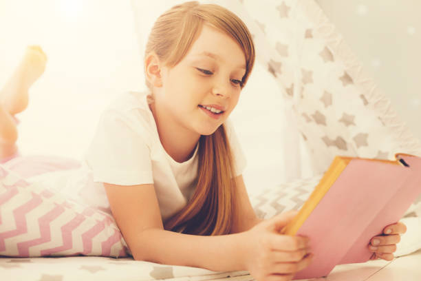 istock Happy positive girl reading a story 937039214