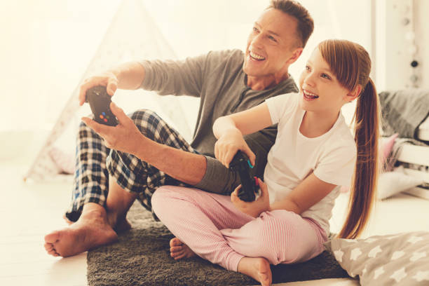 Happy cheerful girl playing video games