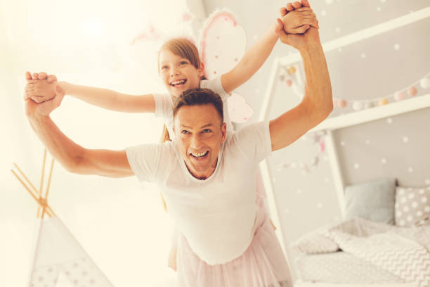 istock Happy delighted man having fun with his daughter 937042062