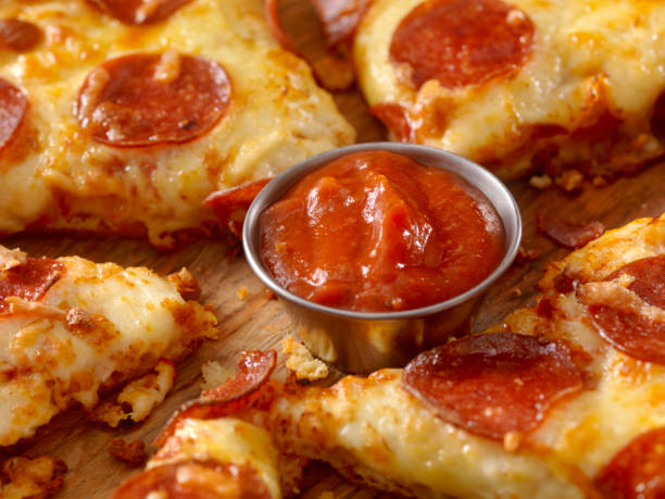 istock Marinara Dipping Sauce with Pepperoni Pizza 937056878