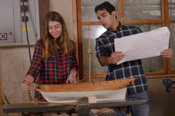 istock A happy young family is doing a model on a sailboat 937057040