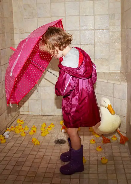 Girl taking a shower with her duck