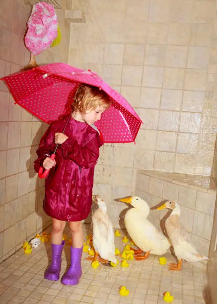 Girl taking a shower with her ducks