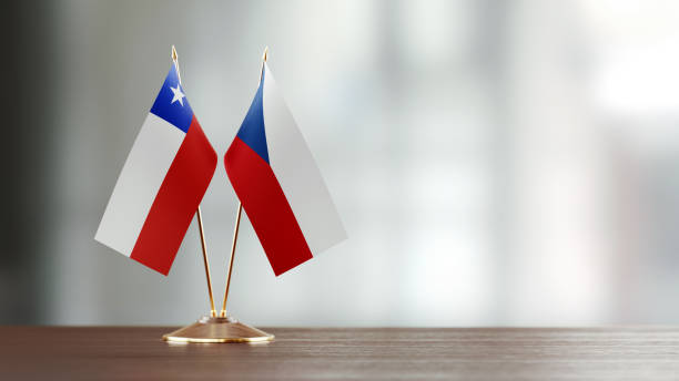 istock Chilean And Czechoslovakian Flag Pair On A Desk Over Defocused Background 937060802