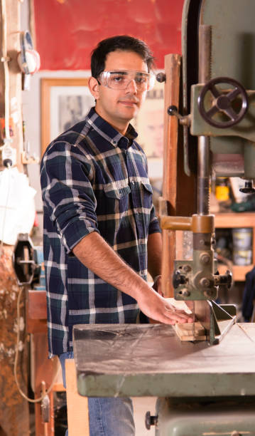 istock Carpenter works in his carpentry workshop of band saw 937060886