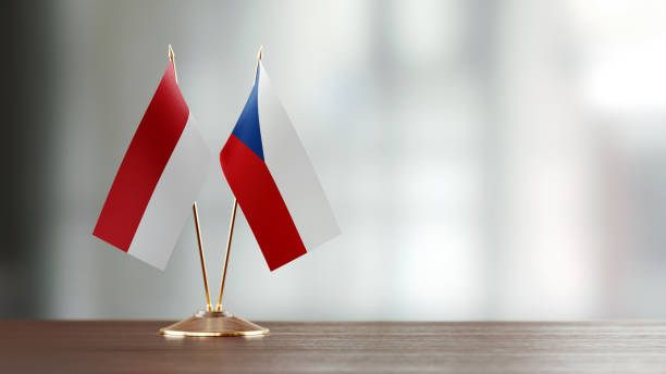 istock Indonesian And Czechoslovakian Flag Pair On A Desk Over Defocused Background 937061122