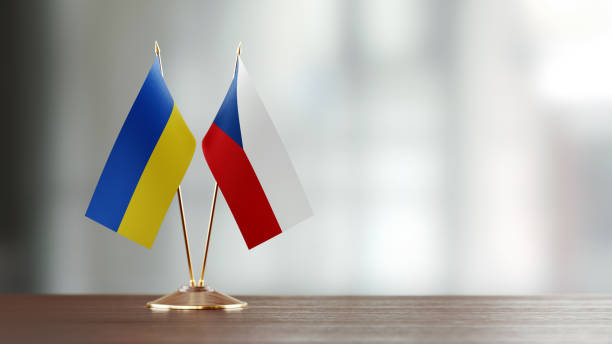 istock Ukrainian And Czechoslovakian Flag Pair On A Desk Over Defocused Background 937064136