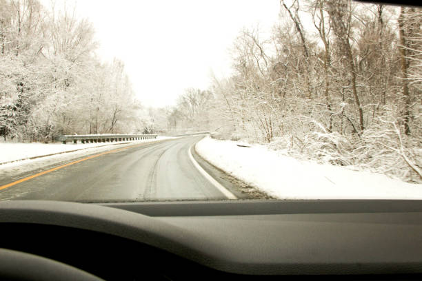 istock Winter driving on a snowy country road 937064826