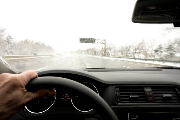 istock Winter driving on the interstate in bad weather 937064846