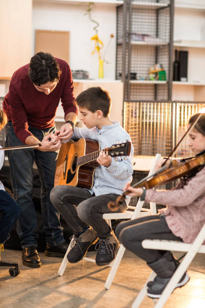istock Music class is fun with my cool teacher 937074524