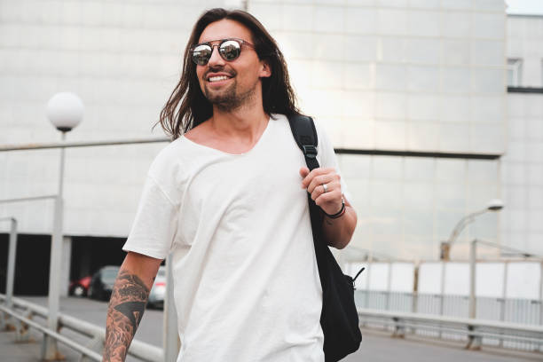 istock Happy man walking in the city 937074942