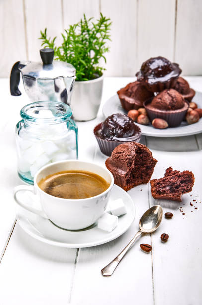 istock Coffee in clay cup with chocolate muffin 937075912