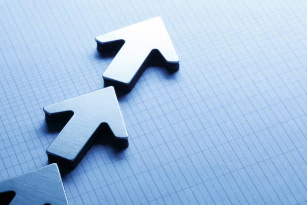 istock Arrows On Top Of Graph Paper 937081180