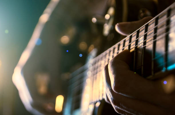 istock Rock concert, a musician is playing the guitar 937086050