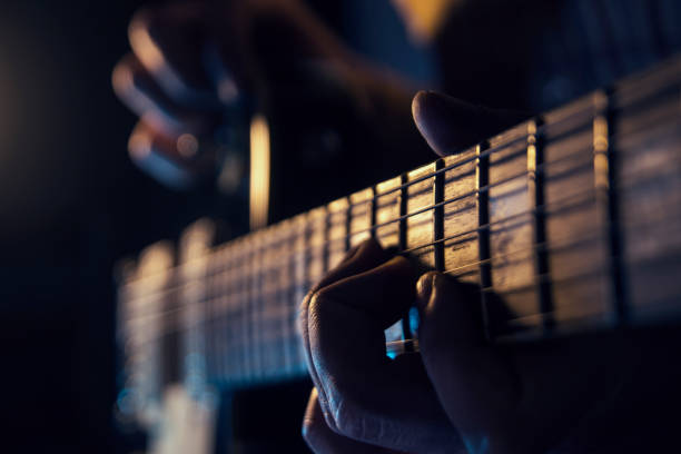 istock Rock concert, a musician is playing the guitar 937088456