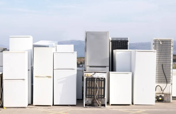 Fridges stacked in a row for recycle used refrigeration units pollution gas