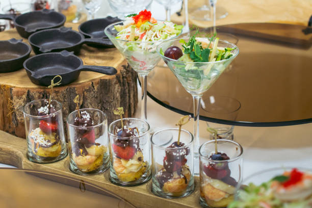 istock Beautiful catering banquet table with different food snacks and appetizers decorated for celebration party, closeup. 937099580