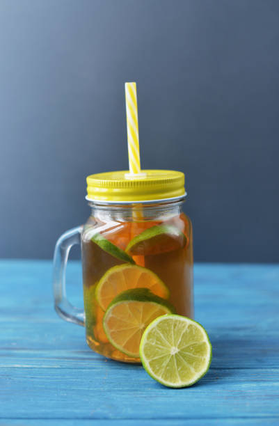 istock fresh drink tea with lime fruit in a glass 937099582