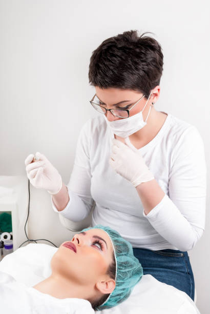 istock Attractive woman scared of tattoo needle 937100022