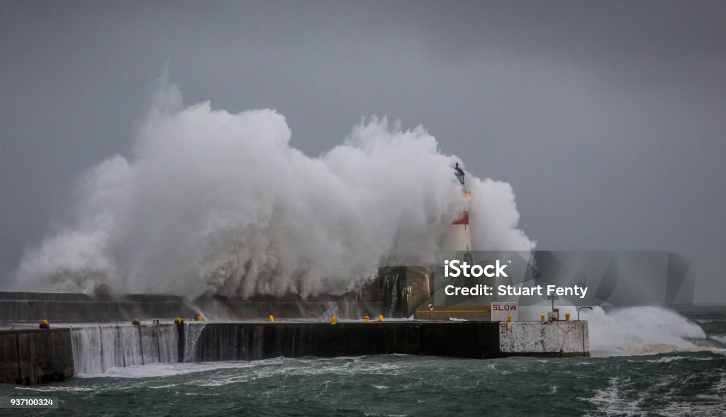 Stormy sea at Fraserburgh Waves breaking over harbour wall Environment Stock Photo