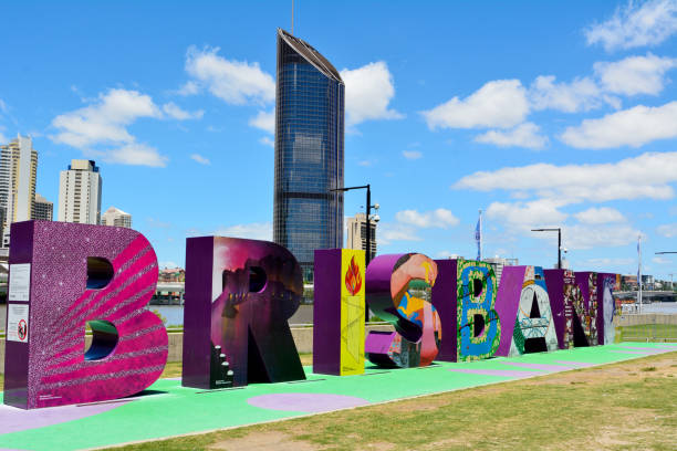Brisbane, Queensland, Australia - January 6, 2018. Letters making Brisbane sign in South Bank Parklands, with modern buildings in the background.