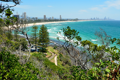 Burleigh Heads, Gold Coast, Queensland, Australia - January 13, 2018. View from Burleigh Heads National Park, toward Surfers Paradise, with buildings, cars, vegetation and people.