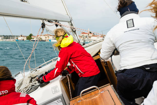 istock Sailing Boat Leaning to the Left on Rippled Sea 937111794