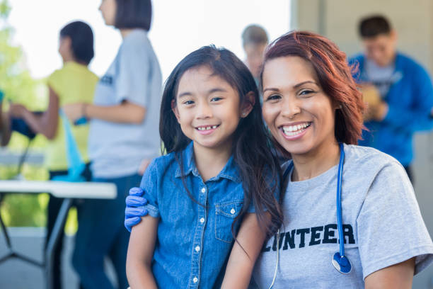 istock Confident volunteer doctor with young patient 937112212
