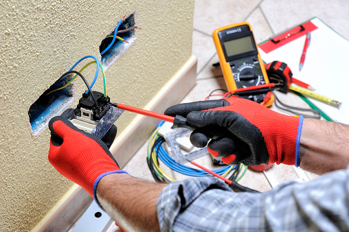 Electrician Technician At Work With Safety Equipment On A Residential  Electrical System Stock Photo - Download Image Now - iStock