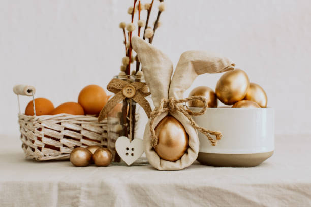 istock Happy Easter concept - gold eggs on rustic linen background. Natural Eco Concept 937117304