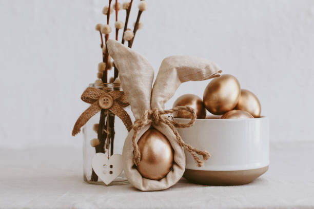 istock Easter eggs. Trendy Bunny Linen Napkin Wrapping Diy idea. Eco Easter Concept 937117306