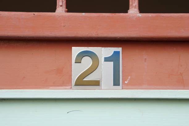 istock House number 21 on old metal fence 937121378