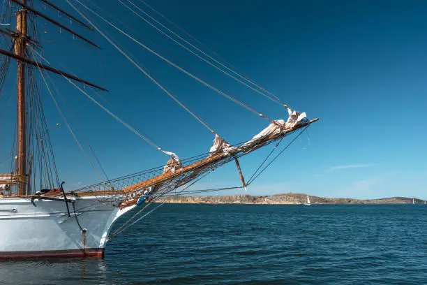 View at the sailing-ship in a Scandinavian country in summer. Blue sky over the scene.