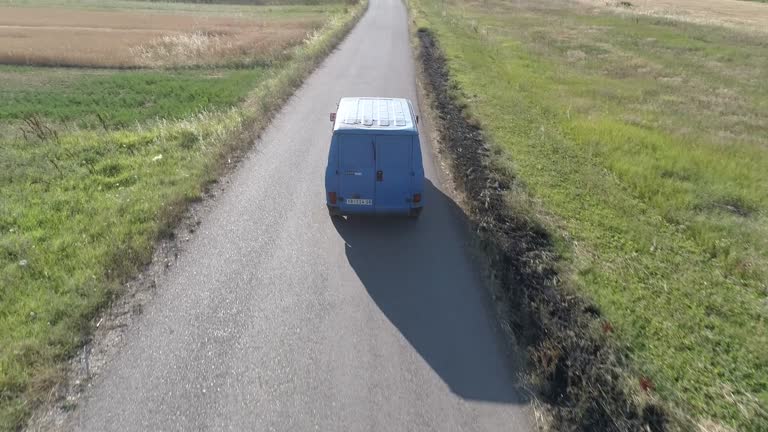 Truck on the country road in the sunset